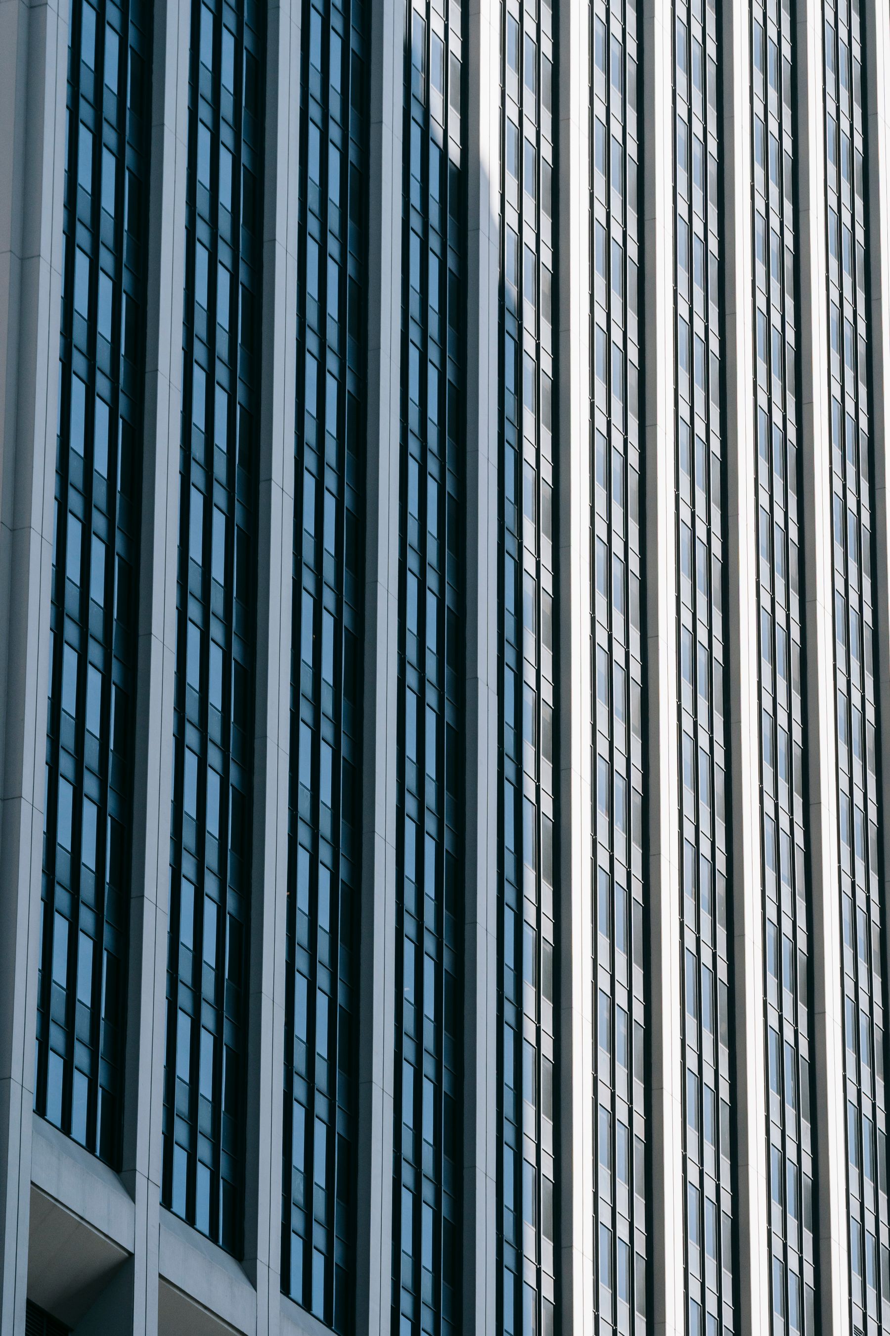 Modern city facade with a disciplined grid of windows and concrete forms